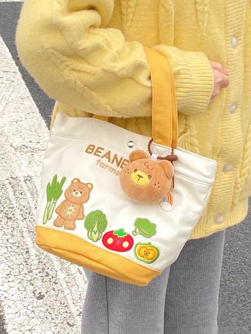 帆布包卡通字母水桶手提包便当包妈咪包溜娃袋帆布手提母婴包布包