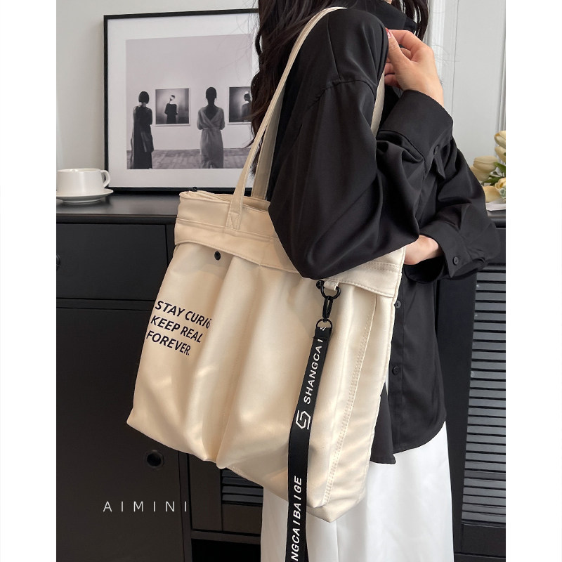 帆布单肩包女小众设计2025新款大容量大学生上课通勤托特包手提袋