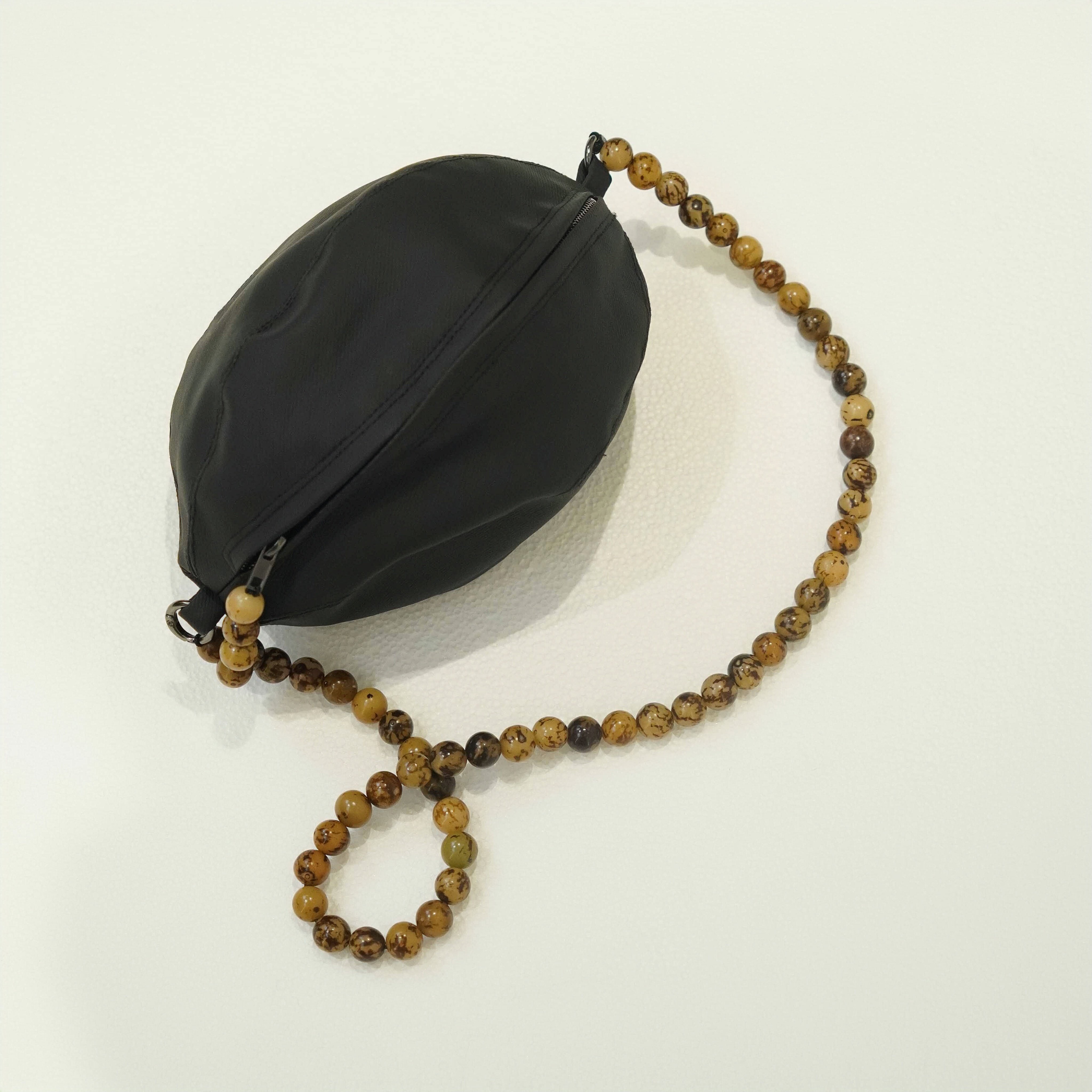 静止的艺术 小众设计橄榄球型手包手工手拿包科技环保皮手抓包,箱包皮具/热销女包/男包,手拿包,淘宝优惠券,粉丝福利购,淘宝优惠卷