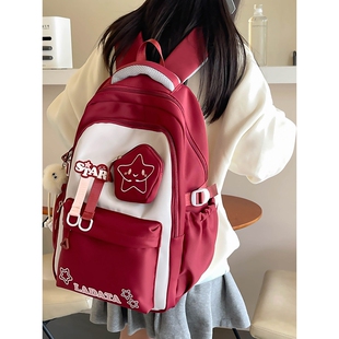 减压书包女生小学生三到六年级减负护脊超轻便大容量初中生双肩包