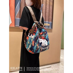 法国CavienKIon轻便外出女包包旅游双肩包旅行休闲女士背包小吉象