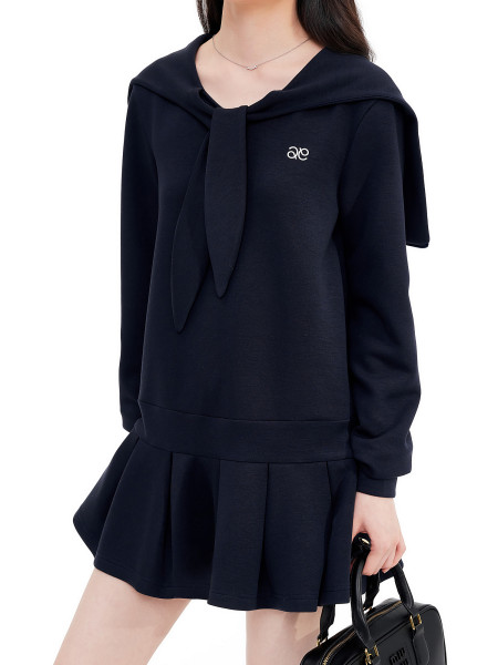 Navy long-sleeve sailor-collar dress worn by a model