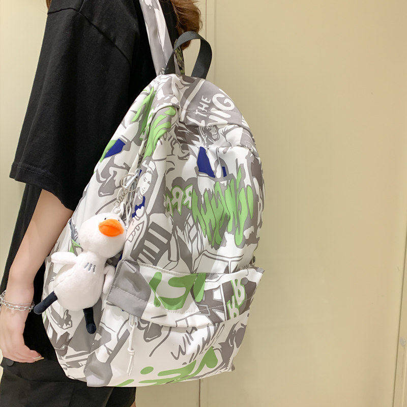 涂鸦印花双肩包女2025新款夏韩版潮流休闲背包男高中大学生书包女