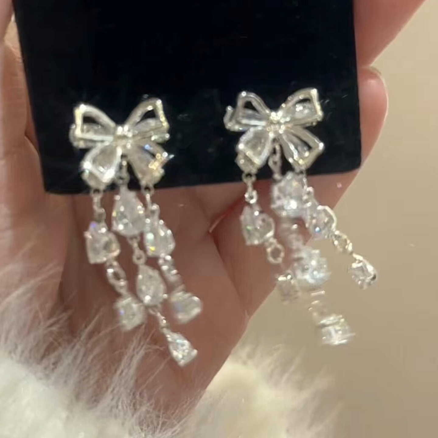 爆闪银色蝴蝶结流苏耳钉女款轻奢小众设计高级感耳环时尚水滴耳饰