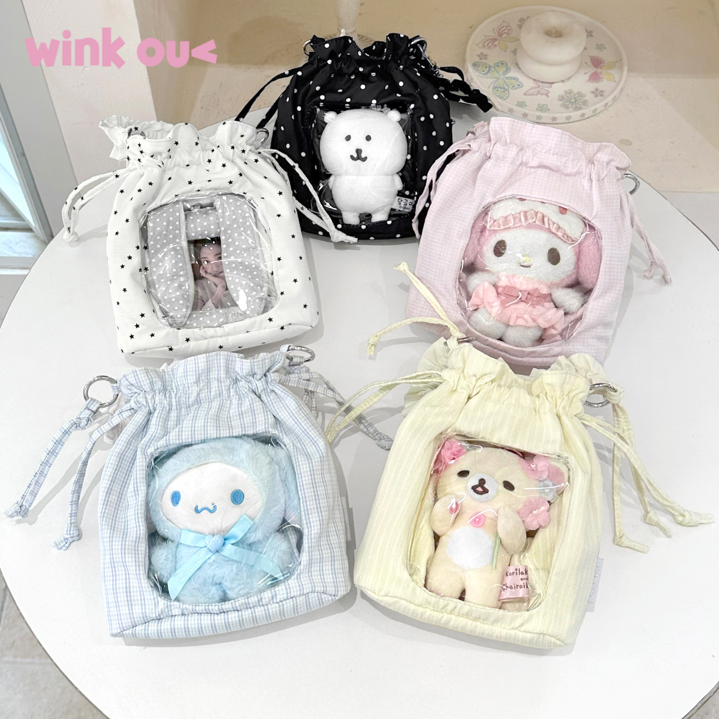 winkouv小型抽绳痛包斜挎包娃包图片