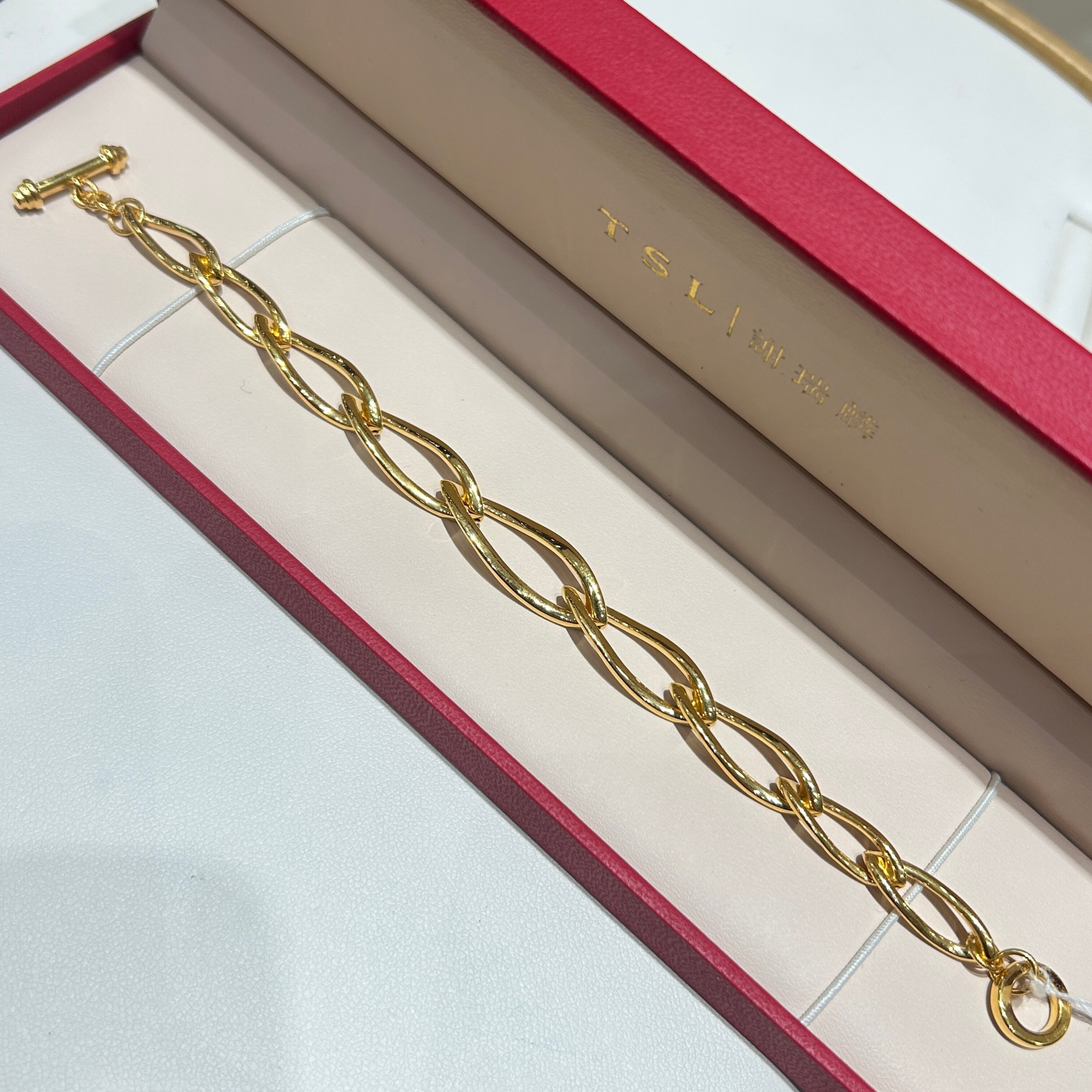 TSL谢瑞麟代购 足金999光面扭环环环相扣黄金手链手串 专柜正品图片