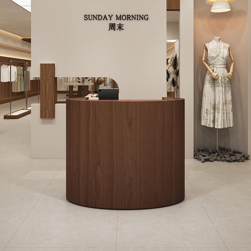 服装店椭圆型收银台小吧台女装店圆弧前台接待台胡桃木柜台收款台