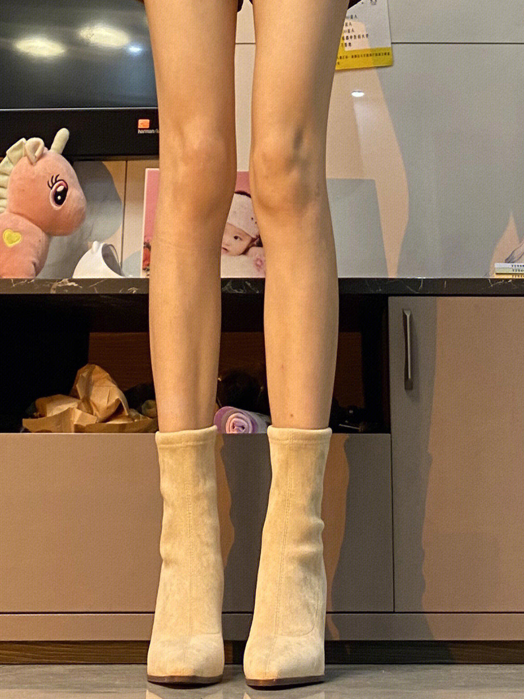 THE ARE WHIRRING AND THE LITTLE HIGH-HEELED SUEDE BOOTIES ARE TOO GENTLE