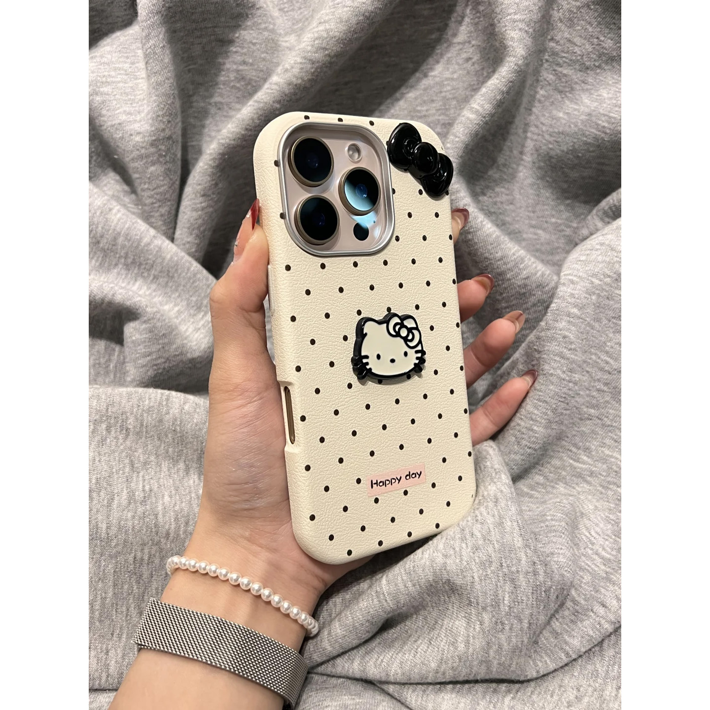 蝴蝶波点立体凯蒂猫腕带iPhone16/15手机壳适用苹果14/13promax皮质硬壳12链条挂绳可爱哈喽HelloKitty新款软