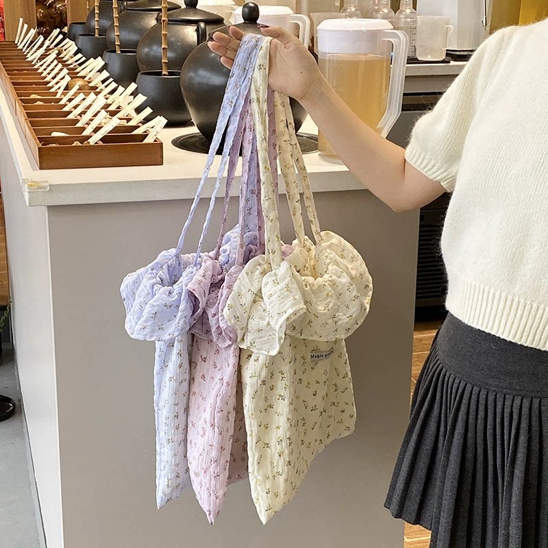 2025春夏新款碎花帆布水桶包韩版女士简约大容量单肩包逛街斜挎包