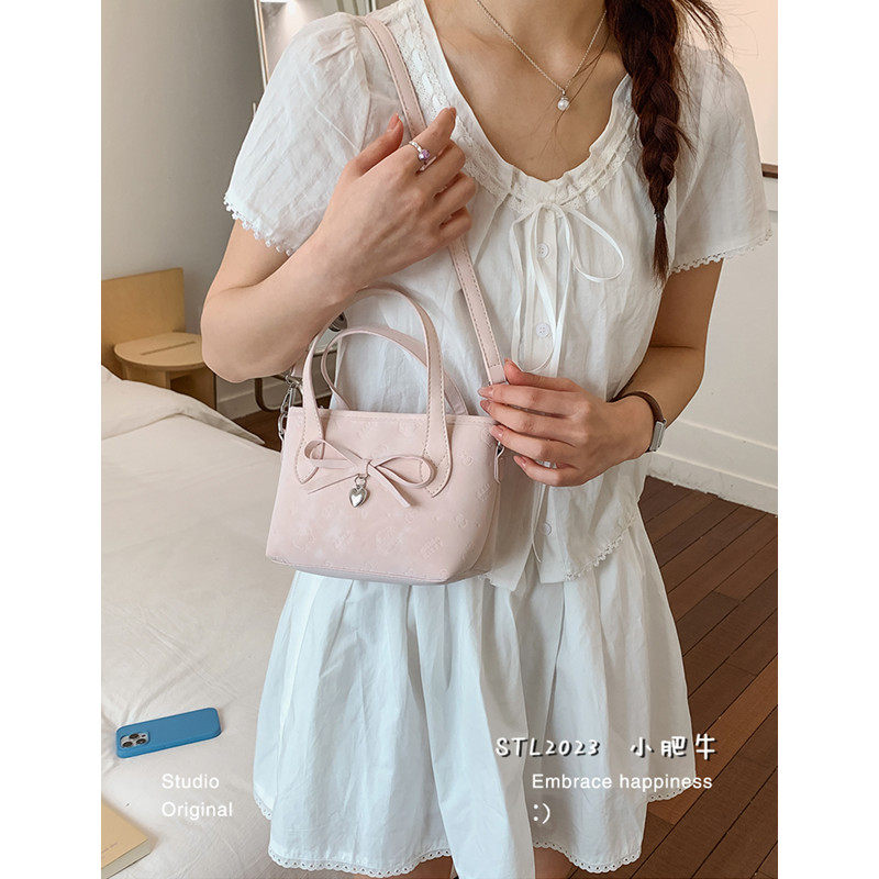 韩版蝴蝶结手提包包女2026春季新款潮时尚水桶包高级感百搭斜挎包