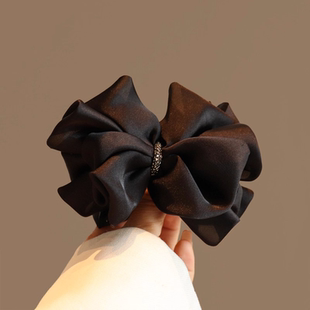 气质黑色蝴蝶结丸子头抓夹女2025新款 高级感马尾夹显发量半扎发夹
