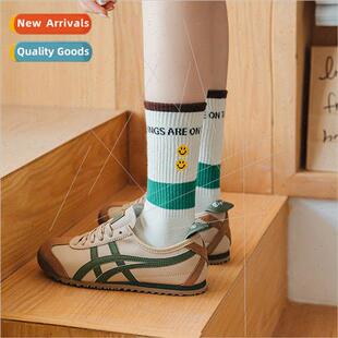 striped green embroidered sports knte Smiley college letters