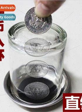 coin into cup coins through cup coasters close-up children m