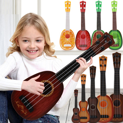 Children's toy ukulele simulates playing Musical Instruments