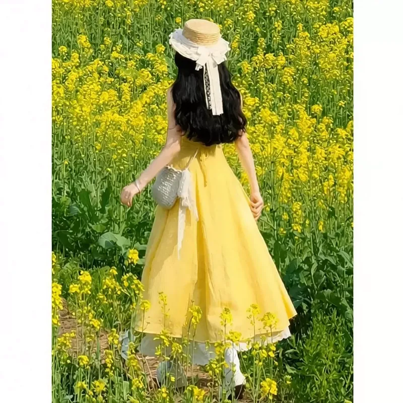 新款多巴胺黄色吊带连衣裙子女春夏季度假风优雅出游穿搭收腰长裙