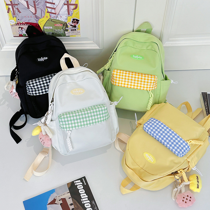 儿童潮流双肩包2025清新糖果撞色女生休闲背包学生轻便尼龙书包新