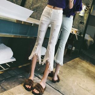 喇叭裤女新款港风裤子超火个性破洞牛仔裤时尚流苏七分裤