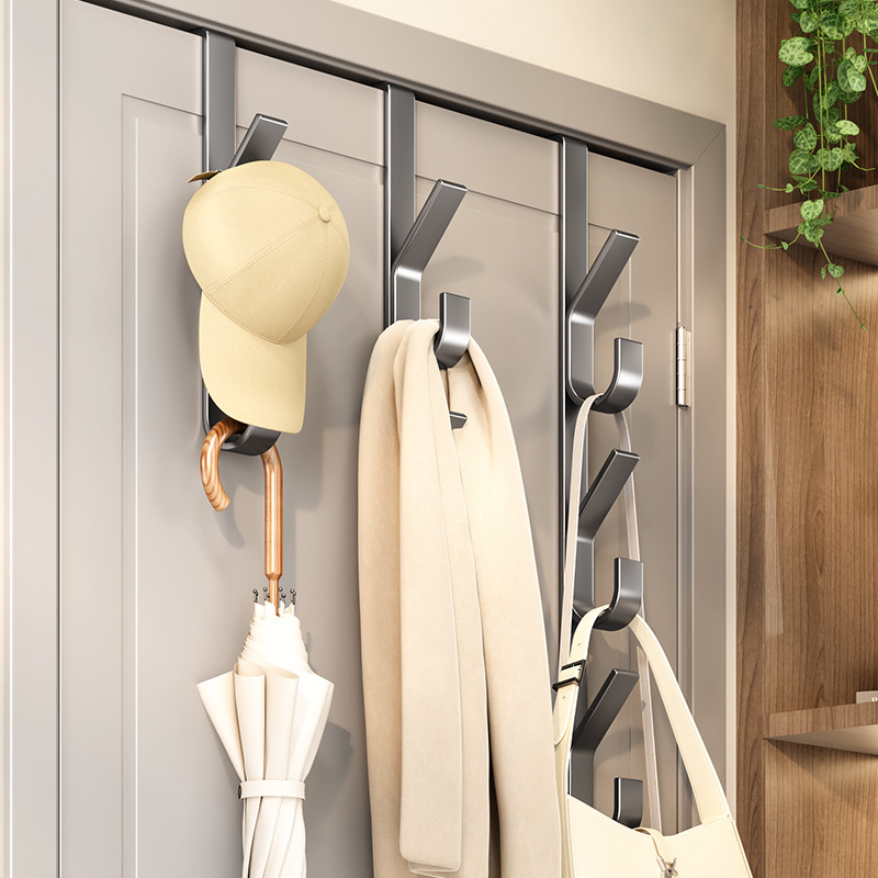 Hanging hooks for clothes and a hat storage rack on the door
