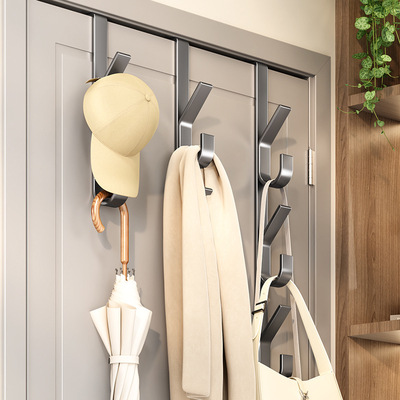 Hanging hooks for clothes and a hat storage rack on the door