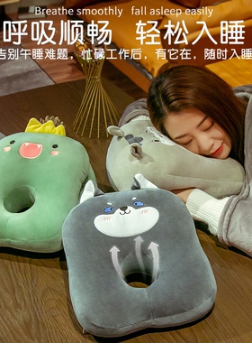 The office is sleeping on the table with a little pillow on