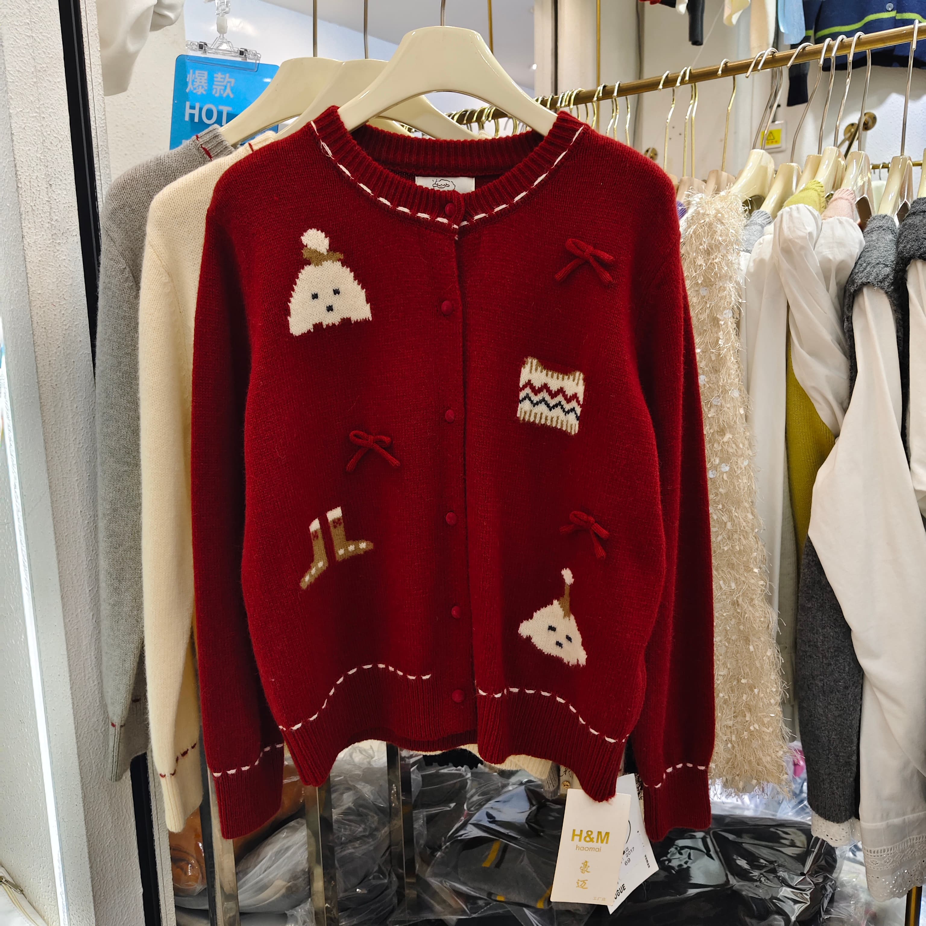 卡通提花蝴蝶结浣熊绒针织开衫女