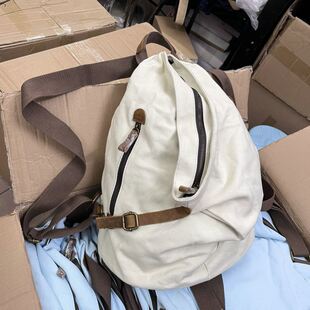 复古三角形水饺旅行双肩包户外个性帆布牛皮背包尾货