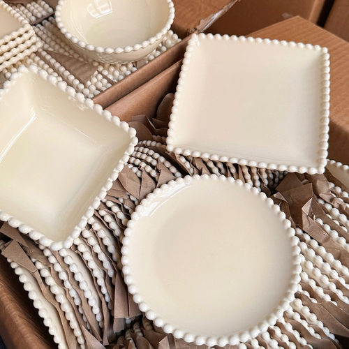Cream colored exquisite dessert cake plate with precious edges, ceramic plate with high aesthetic value, Western style