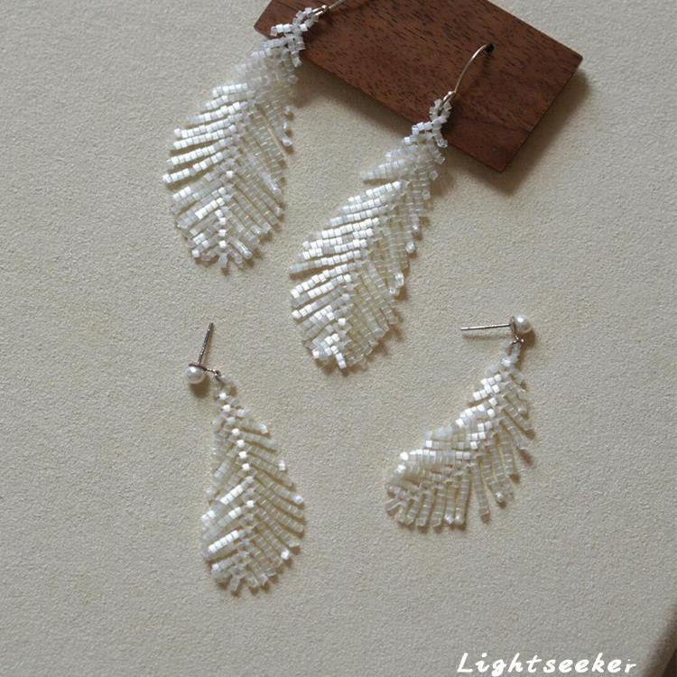 S925纯银针猫眼珠羽毛耳钉女小众清冷感耳钩新中式流苏耳饰高级感