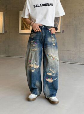 巴黎风格美式潮牌破洞牛仔裤男宽松直筒弯刀裤蓝色纽扣装饰长裤
