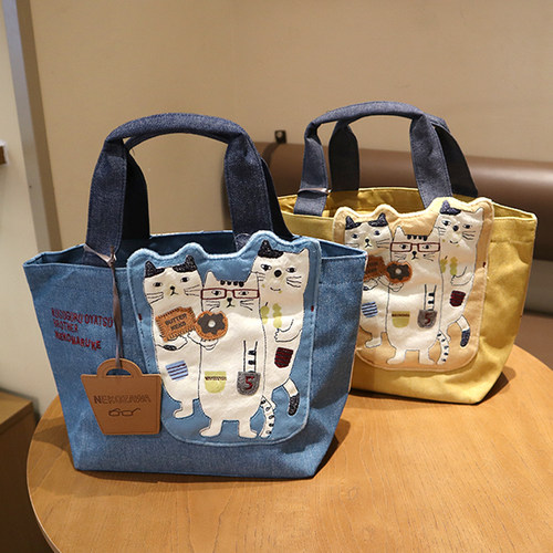 日本kusugusu秋冬新款眼镜猫家族刺绣通勤大容量手提包带饭包托特