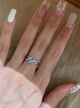 浪漫传说爆闪缠绕交错蓝钻戒指女
