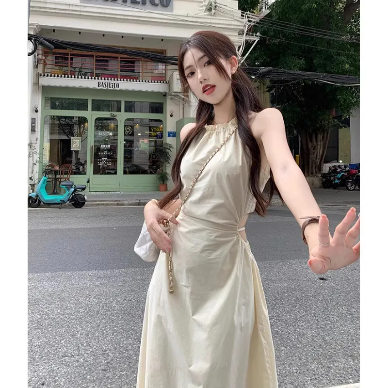 纯欲风挂脖吊带连衣裙女夏季镂空露腰小心机收腰系带显瘦流苏长裙