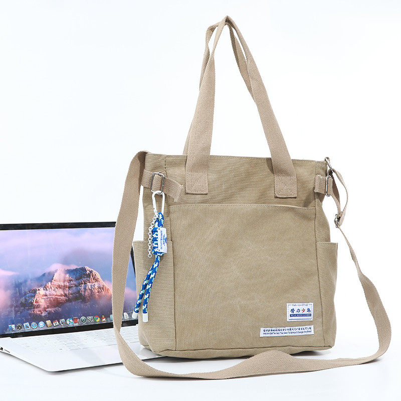 帆布包男学生日系男生邮差包挎包休闲手提单肩包大容量男包斜新款