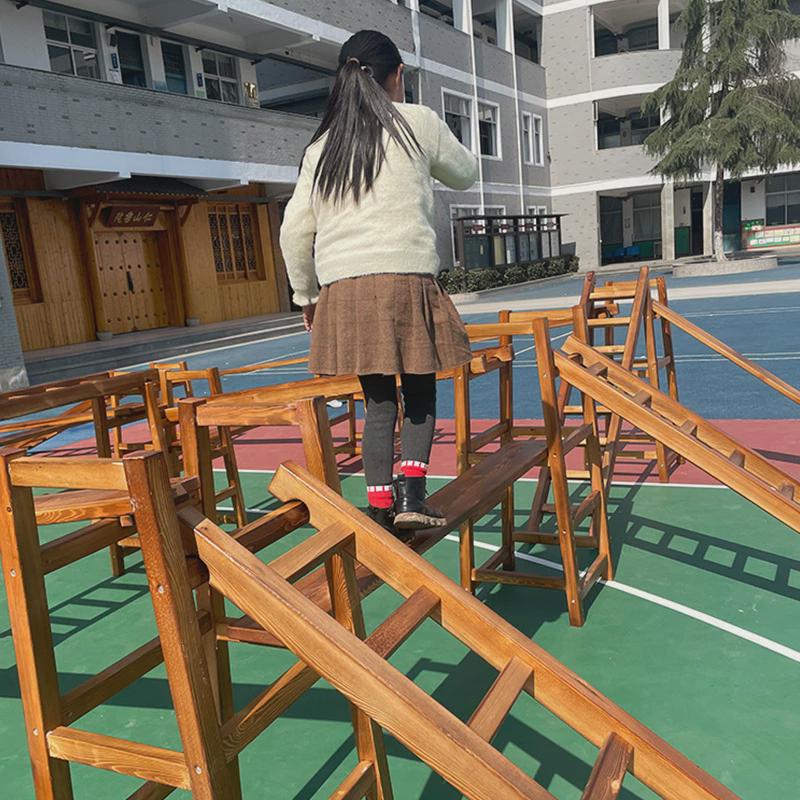 定制幼儿园碳化攀爬架户外儿童安吉游戏平衡板感统训练木质16件套