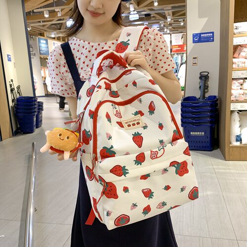 优选日系小清新个性涂鸦初中生书包女大容量休闲草莓印花双肩包