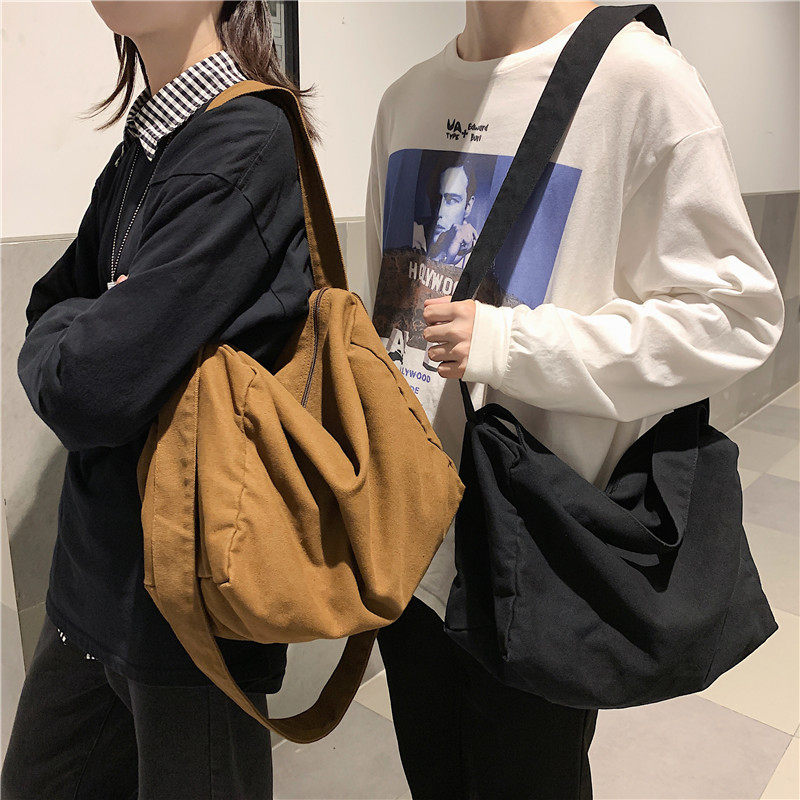 法国专柜Cins Kuku~斜挎包男帆布单肩包女休闲百搭背包日系邮差包