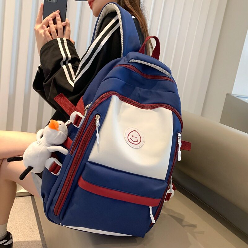 法国MlcanIKans双肩包小学生补课袋2025新款拼色女初中生书包减负