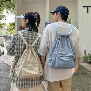 轻便双肩包2024新款大学生休闲包潮流百搭背包束带慵懒风书包女男