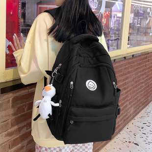 黑色书包女小学生2024年新款大容量初中生高中背包女生双肩包学生