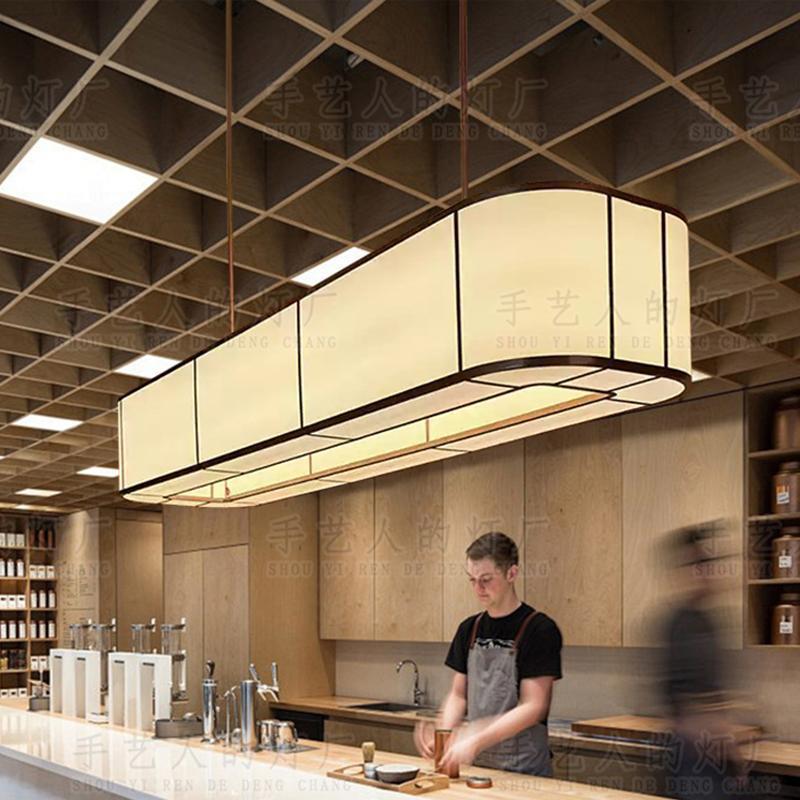 酒店中餐厅椭圆形吊灯自助茶餐厅饭店收银台岛台餐桌米色布艺吊灯