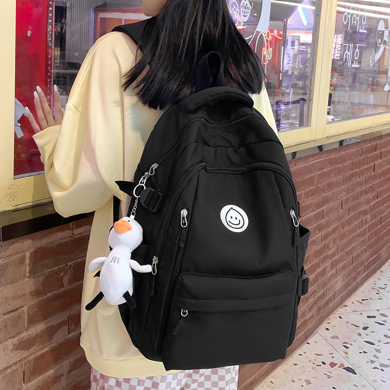 黑色书包女小学生2024年新款大容量初中生高中背包女生双肩包学生