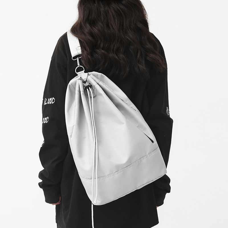 抽绳旅行双肩包男运动骑行侧揹包休闲上课通勤包女大学生百搭书包