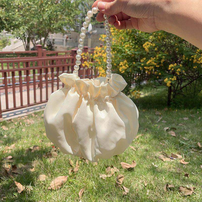 夏季百搭迷你褶皱云朵水桶女包小众手提斜挎休闲通勤零钱包