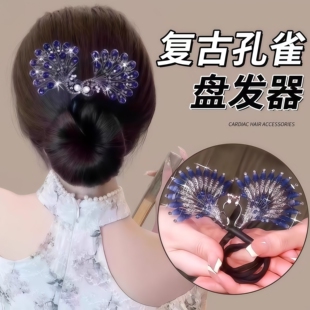 丸子头孔雀开屏盘发器2026新款高端后脑勺扭扭夹子羽毛发夹头饰女