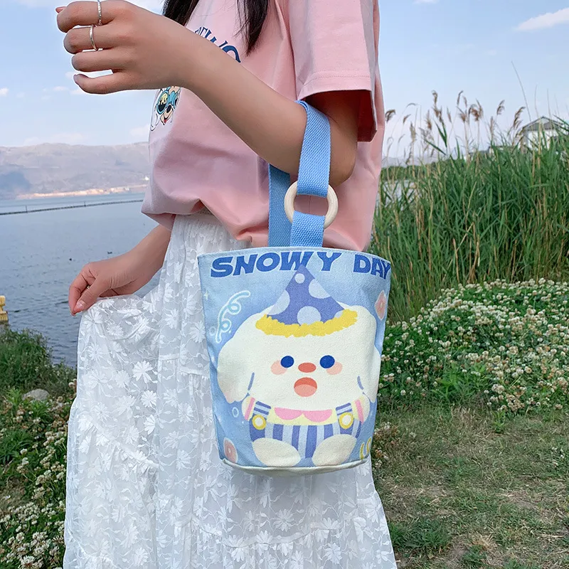 时尚文艺手拎包帆布袋大容量水桶包女2025新款通勤便当包