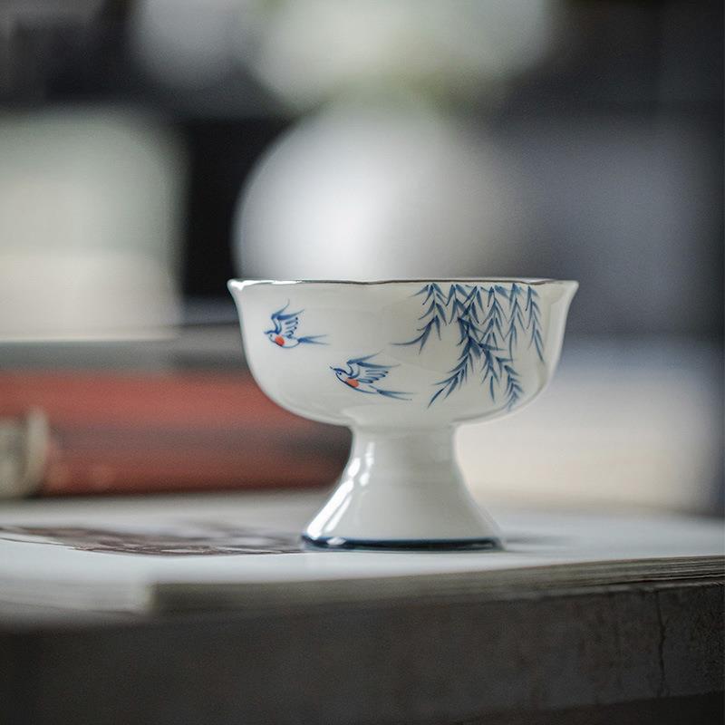 高档玉瓷高足主人杯手绘白瓷釉下彩描白金边花口燕归来棠梨高脚杯