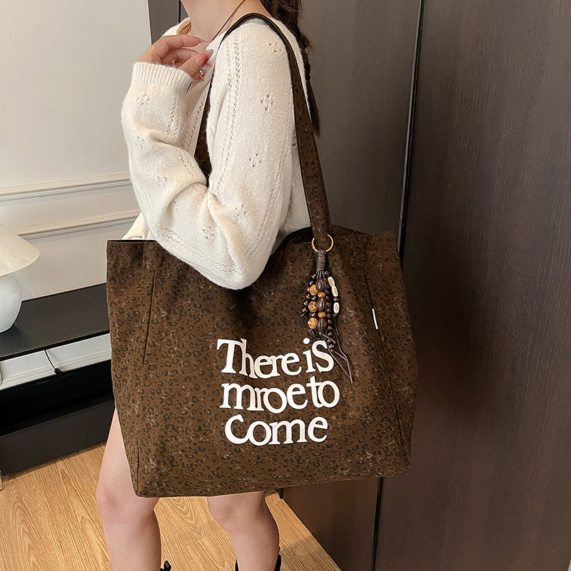 2025新款大容量简约字母帆布包女式休闲百搭单肩包通勤手提托特包