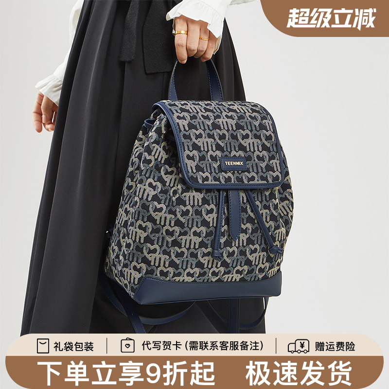 天美意帆布双肩包女2025新款休闲轻便印花通勤背包大容量旅行书包