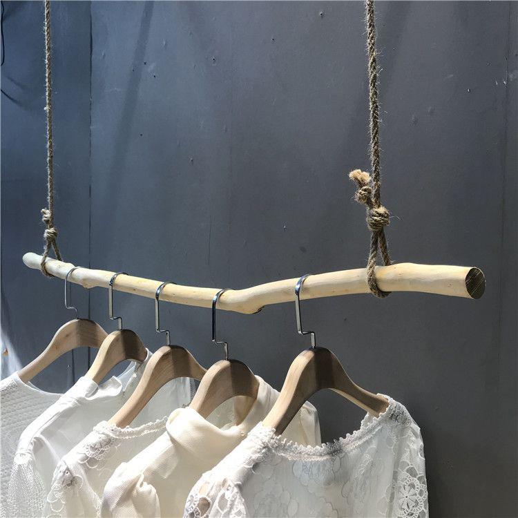 童装店麻绳树枝挂衣杆服装店上墙展示架实木衣架壁挂装修陈列货架